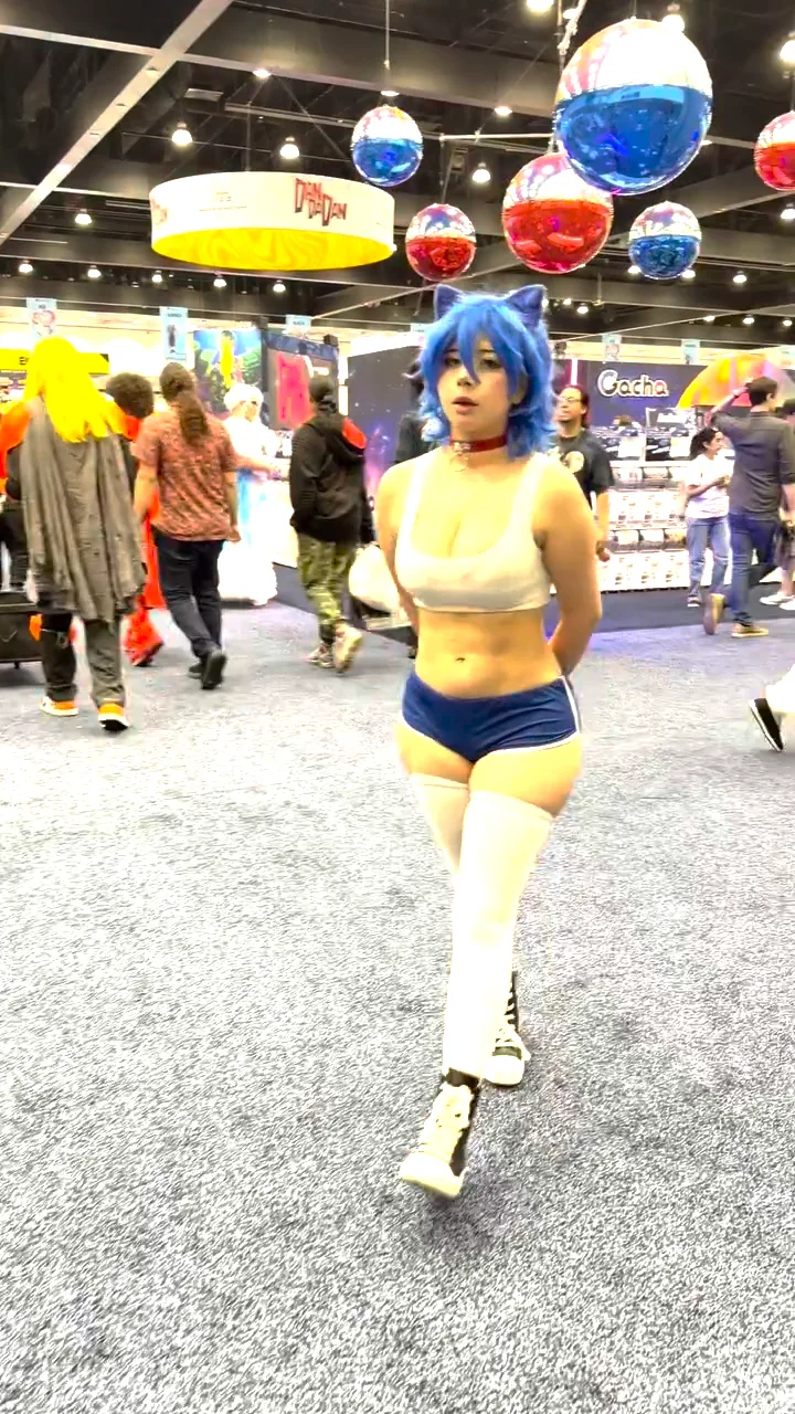 The source video: another creator walking a convention floor — content that already went viral